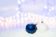 Holiday ornaments in snow