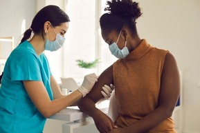 doctor vaccinating a patient