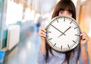 Adult holding clock