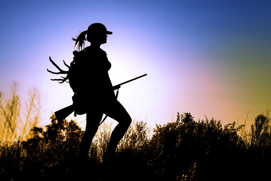 Silhouette of female hunter