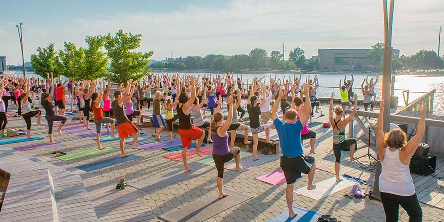 People exercising on Green Bay's CityDeck along the Fox River