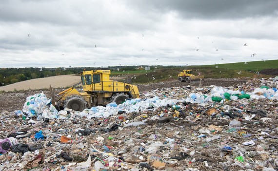 A bulldozer pushes through landfill waste at a Dane County landfill.