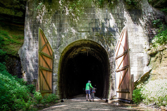 man outside tunnel on elroy-sparta state trail