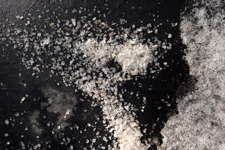 Salt on asphalt with snow