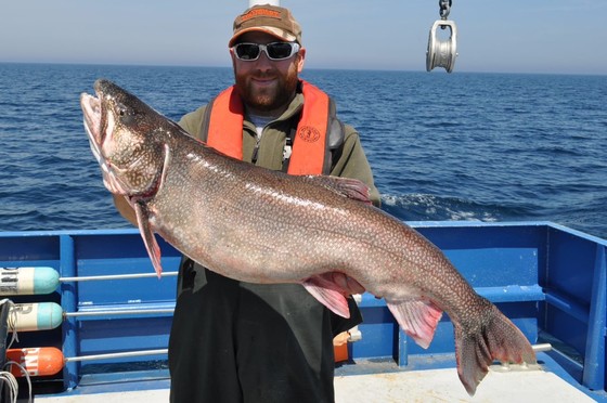 man holding large lake trout