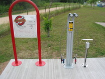 Image of bike repair station and trailhead on bike trail