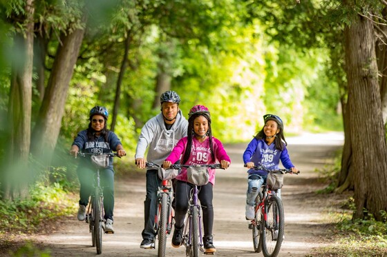 family biking on trail at peninsula state park