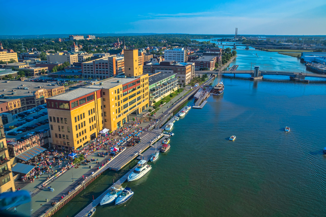 People gather for a concert on the CityDeck in downtown Green Bay along the Fox River