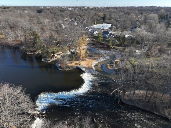 Aerial view of the Milwaukee River Kletzsch Park Dam in winter. 