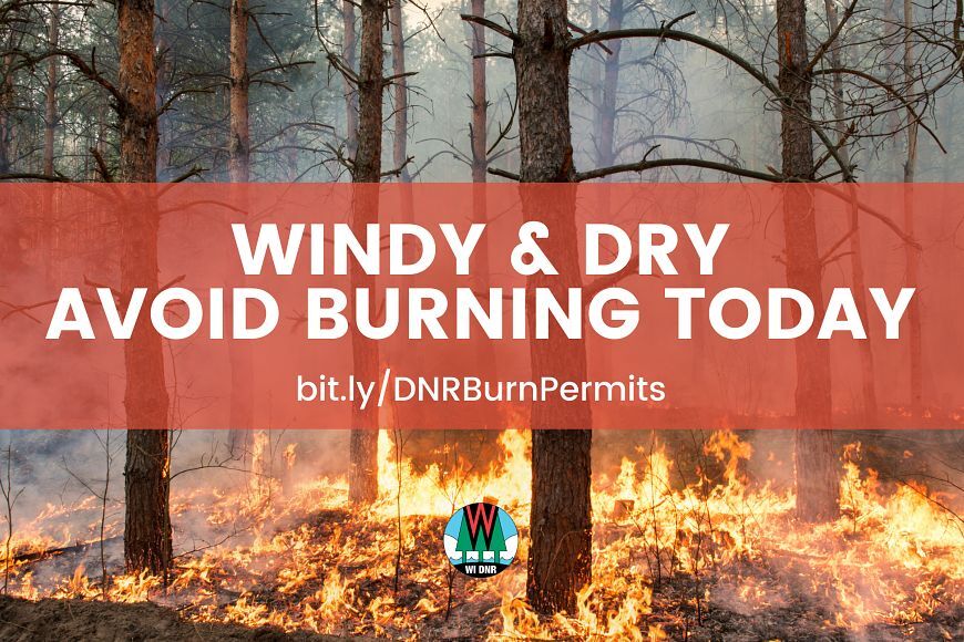 A graphic with a background of a wildfire with text that reads "Windy and dry; avoid burning today."