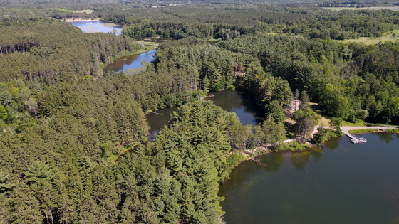 a drone photo of Hartman Creek State Park with several bodies of water and lots of green trees