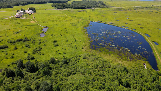 An aerial view of the visitor center and a nearby pond at the George W. Mead Wildlife Area