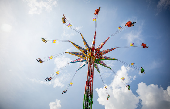 Fairgoers on a spinning ride at the Wisconsin State Fair