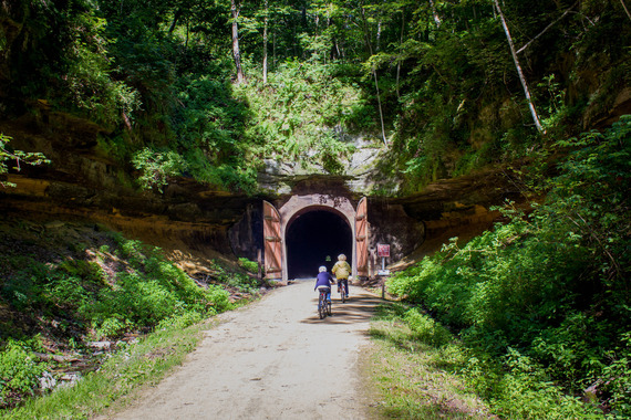 grandma and child biking into a Elroy-Sparta tunnel