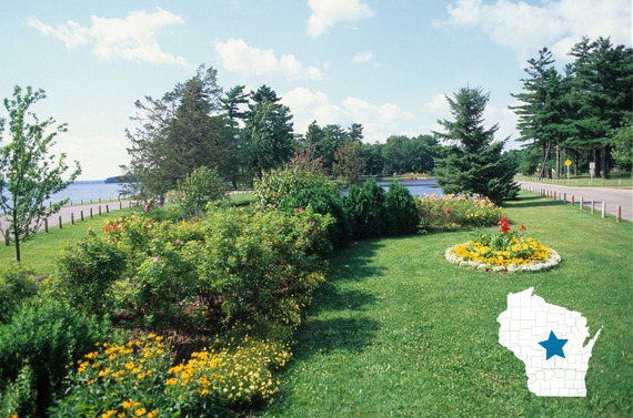 Bike path by a garden and water with map of Wisconsin