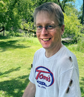 Photo of DNR Forest Health Specialist Bill McNee with cicadas on his shirt