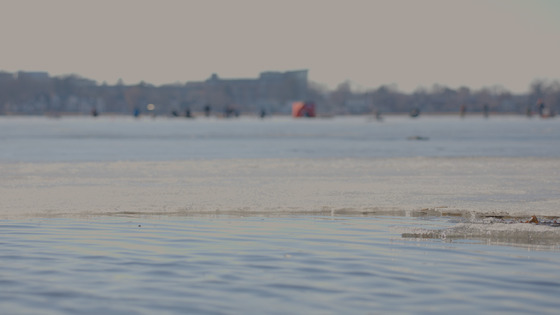 Thin, unsafe ice over a lake.