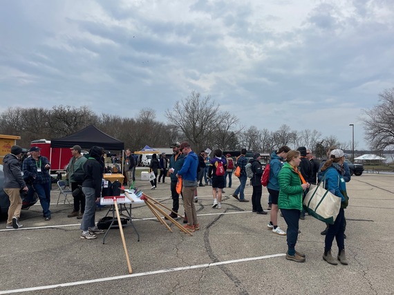 People in a parking lot talking