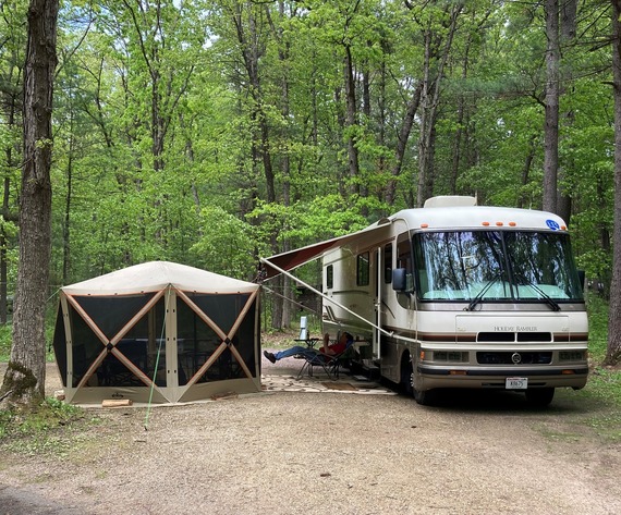 Camper RV in Forest Campsite