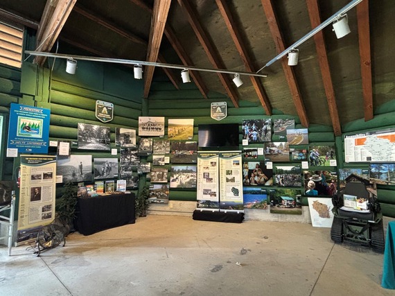Historical images inside a green painted cabin at State Fair