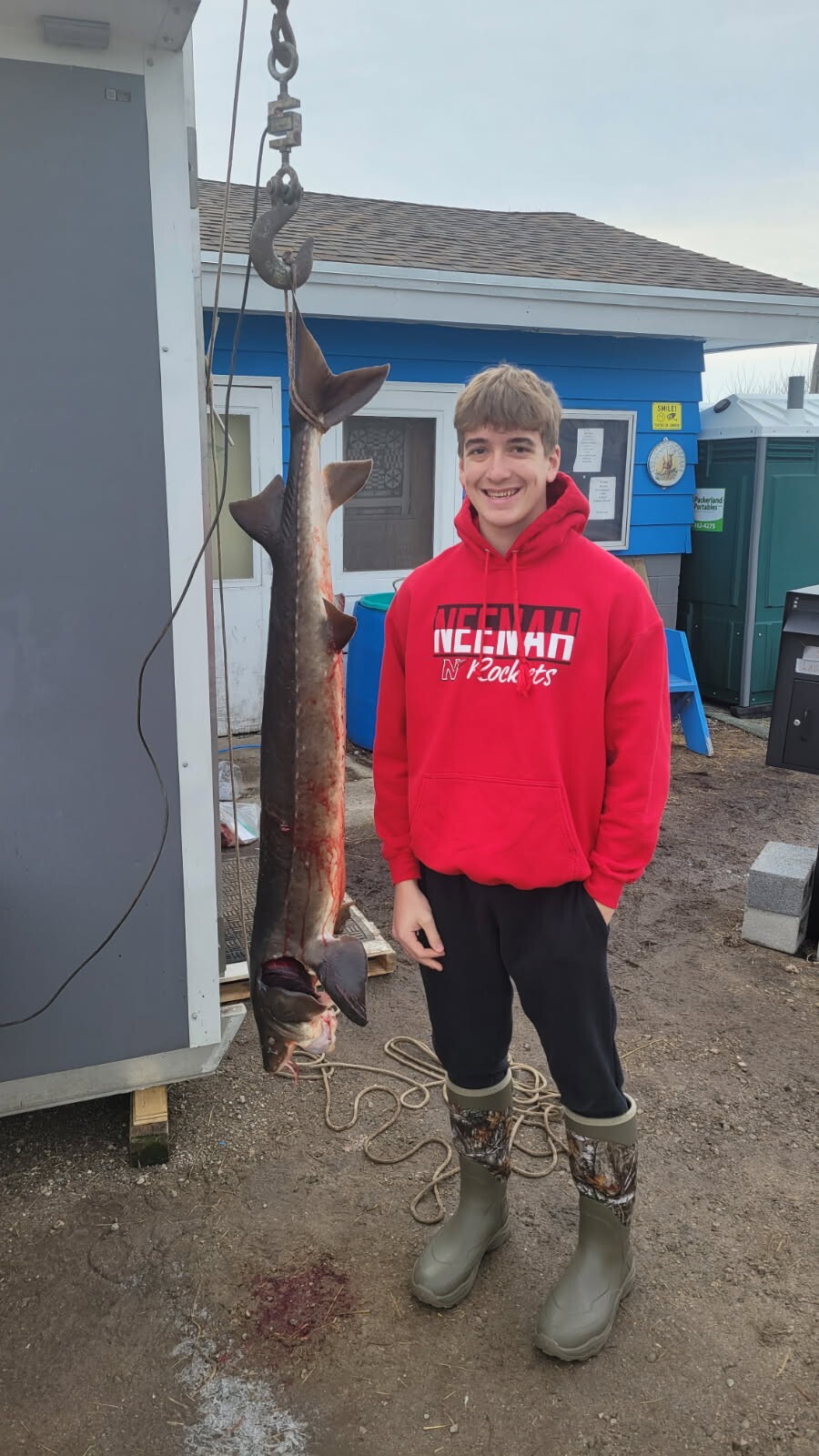 Kole Gilman poses with his sturgeon.