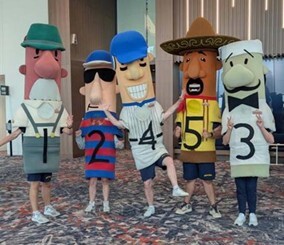 The Milwaukee Brewers Famous Racing Sausages (mascots) standing in a line.