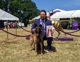 Man and dog with ribbon