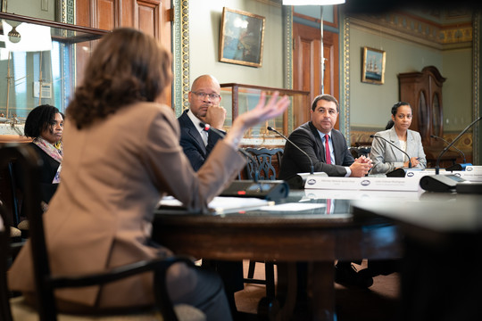 Josh Kaul at table with other Attorneys General around the country and Vice president Kamala Harris