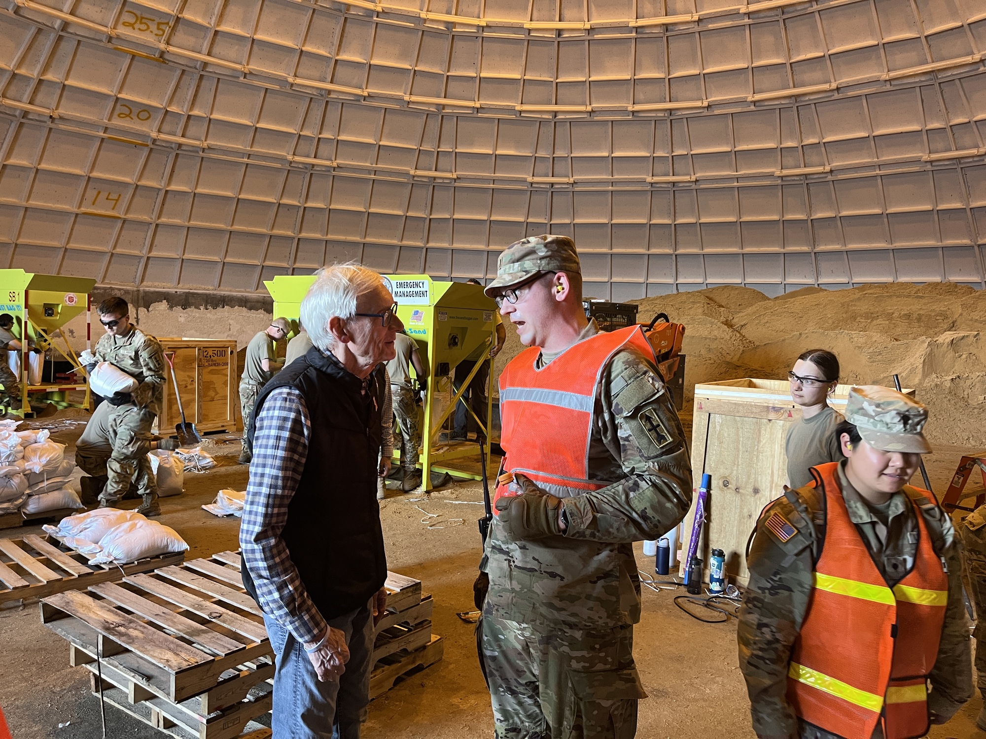 Governor Evers speaks with a member of the Wisconsin National Guard.