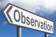 The word "observation" on a sign