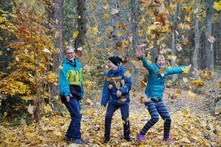 Children playing in fall leaves