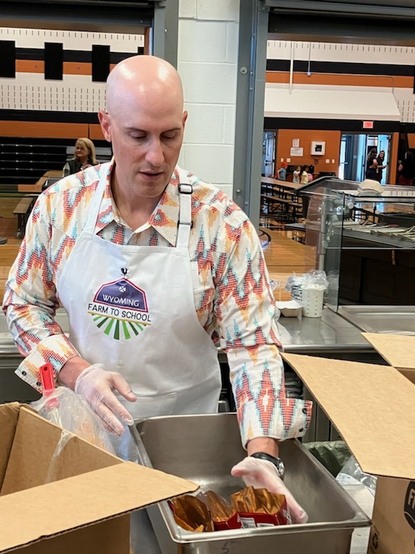 Dicky Shanor serving walking tacos at Burns Elementary