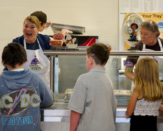 First Lady Jennie Gordon serves  lunch to students.