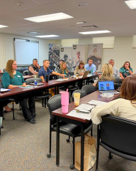 Megan and Level Up Cohort meet and discuss education.