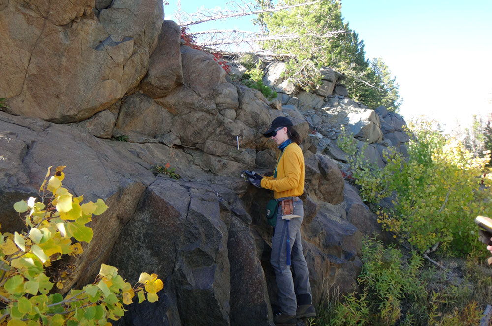 WSGS geologist Patty Webber sampling a particularly magnetite-rich gabbro from the Lake Owen Complex.