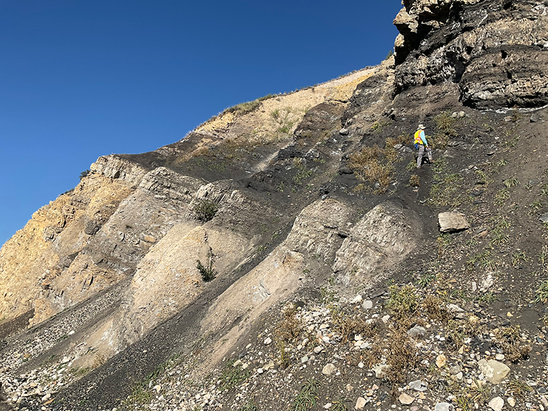 Two geologists examine the contact between the Retort and Tosi Chert members of the Phosphoria Formation along Gros Ventre Road.
