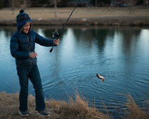 kid fishing at pond