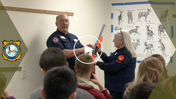 YouTube thumbnail of hunter education instructor teaching class