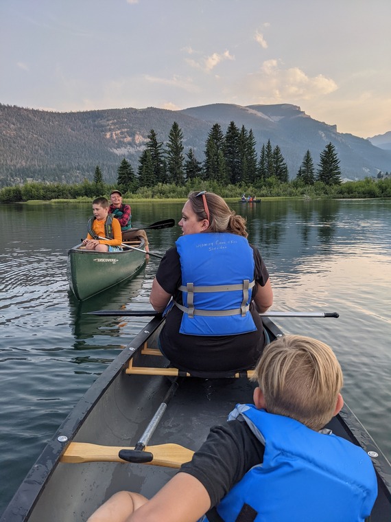 Family camp participants in canoes at Whiskey Mountain Conservation Camp