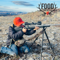 Young hunter in the field wearing a Food from the Field hat