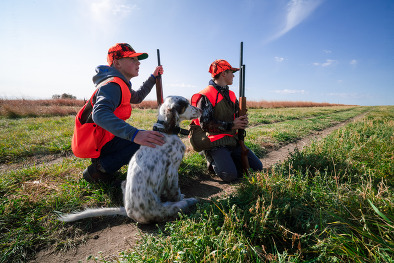 Youth hunters and dog at pheasant hunt