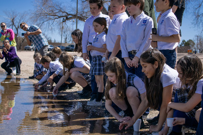 Students release trout in pond