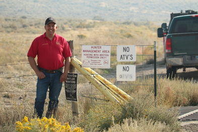 Game warden with sign