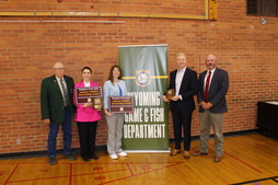 Representatives accept the 2023 Industry Wildlife Stewardship Award