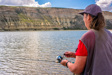 Woman fishing on Flaming Gorge Reservoir