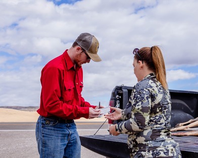 Hunter check station, woman checking in antelope