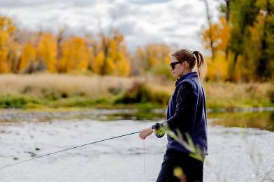 Woman fishing in the fall 