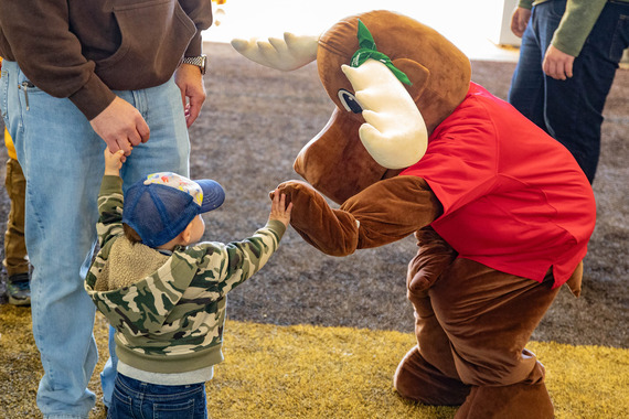 Mardy the moose gives high fives at the UW game