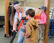 Hunter education instructor teaching student